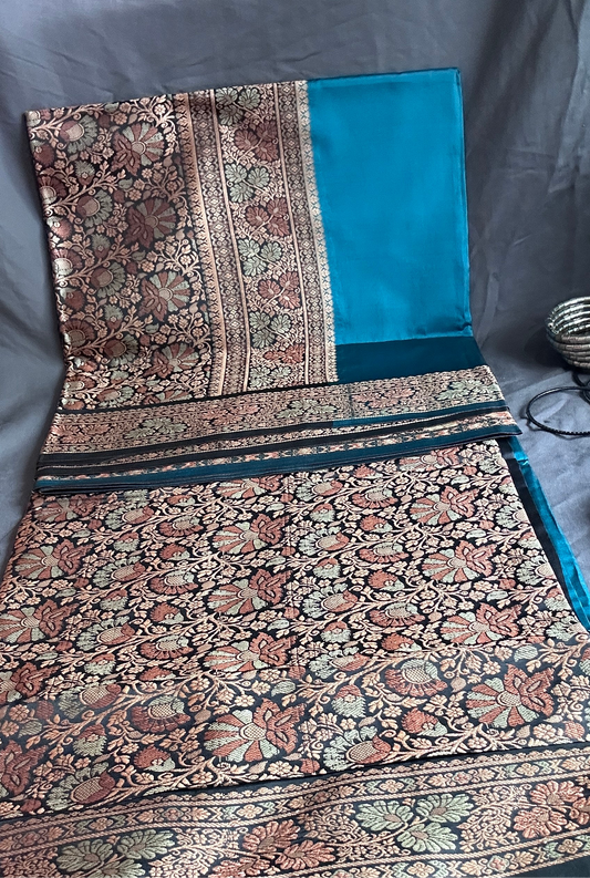 Elegant Blue Saree with Intricate Floral Pattern