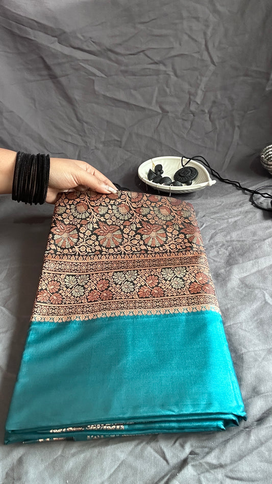 Elegant Blue Saree with Intricate Floral Pattern